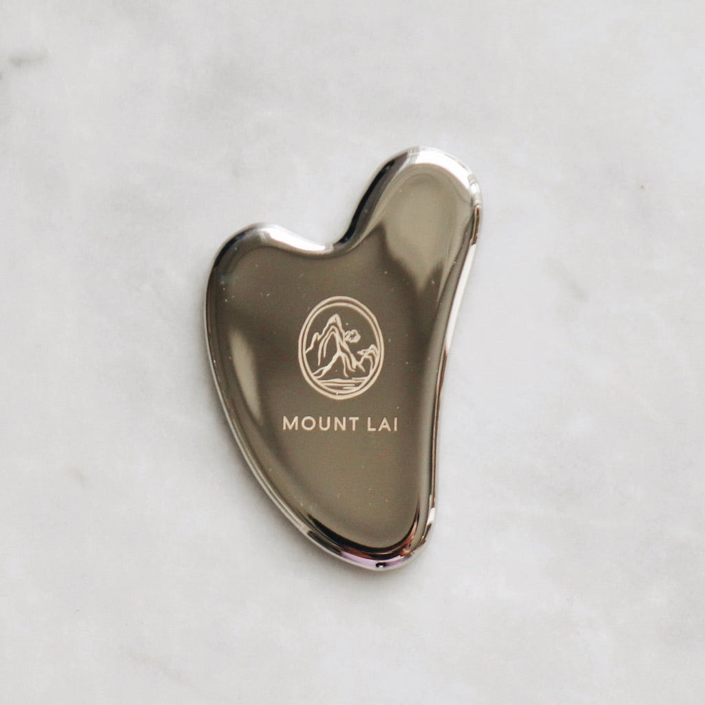 L'outil de lifting facial Gua Sha en acier inoxydable